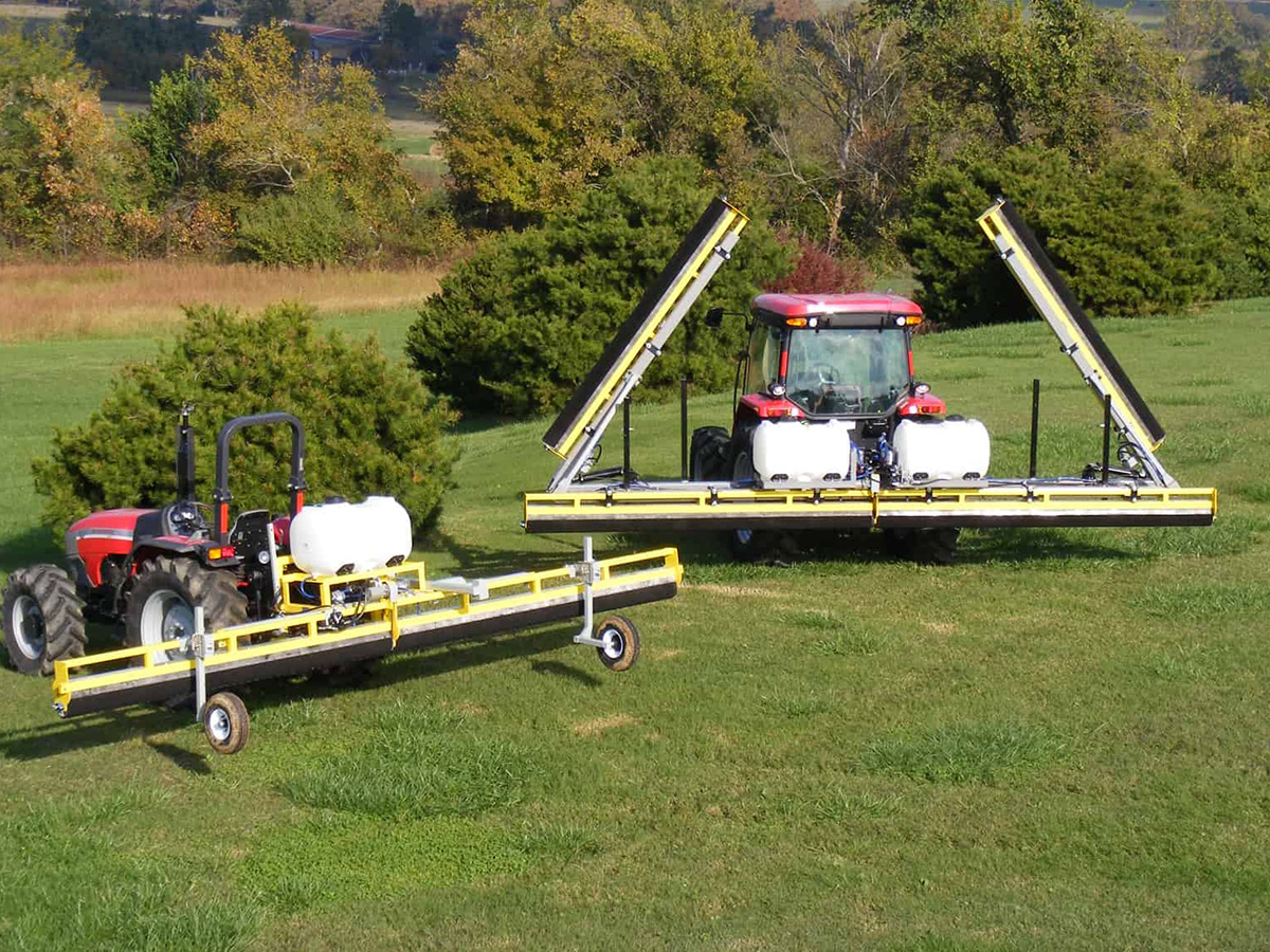 GrassWorks Manufacturing Flex Unit Weed Wiper and 3-Point Tractor Mount Weed Wiper in action on a grassy field.