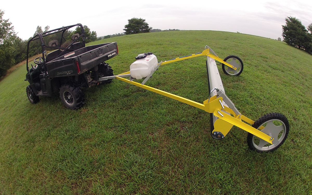 Pull-Type Weed Wiper attached to an ATV, demonstrating weed control flexibility.